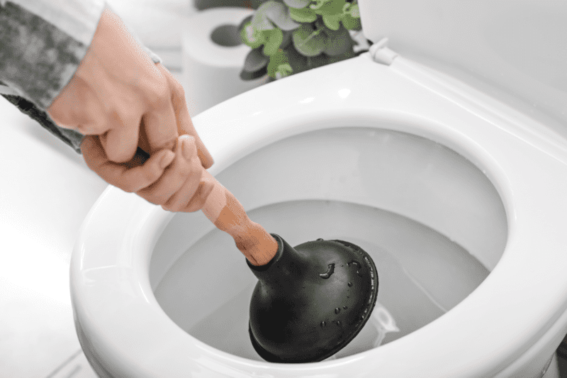 using plunger to unclog toilet bowl fixing kitchen sink